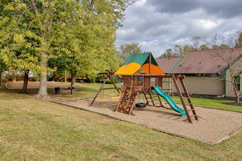 Playground with a swing set and slides in a park